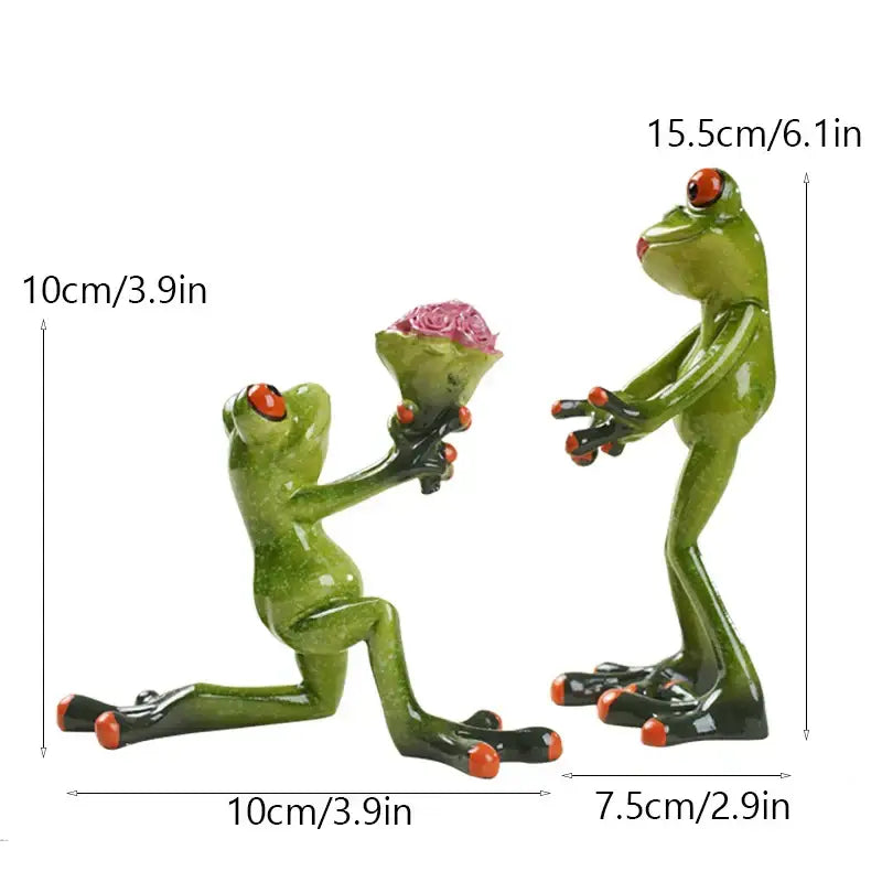 Green resin decorbites funny frog couple figurine with one kneeling holding pink roses and the other standing with red eyes