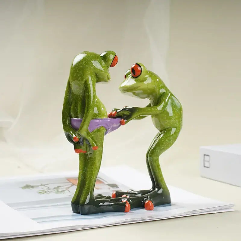 Decorbites funny frog couple resin decor features a green resin frog with red eyes holding a purple bowl