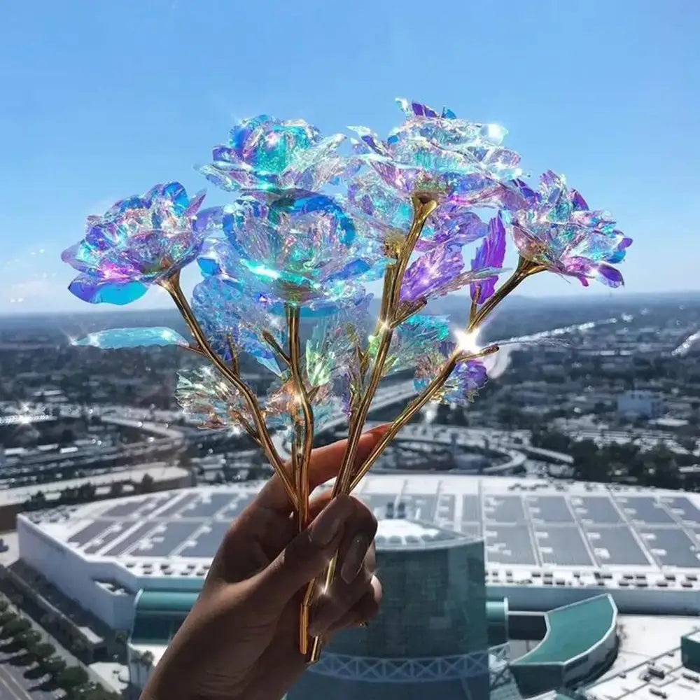 Iridescent glass galaxy rose with golden stems glowing in blue and purple by decorbites for wedding centerpiece