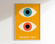 Minimalist decor bites bauhaus canvas poster with stylized eyes in teal and orange on vibrant yellow background