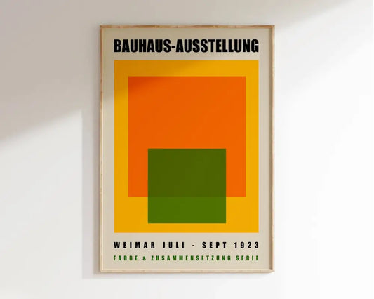 A framed DecorBites™ geometric bauhaus canvas poster with bold orange, green, and yellow shapes on cream background