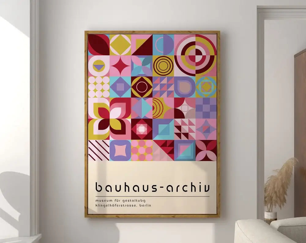 A framed decorbites™ geometric bauhaus canvas poster with vibrant pink yellow blue and purple abstract shapes on cream background