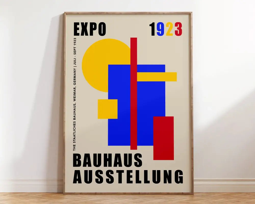 A geometric bauhaus canvas poster with bold yellow blue and red shapes and black text on cream background by decorbites