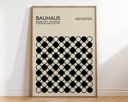 Beige geometric bauhaus canvas poster with black circular patterns and minimalist typography in light wood frame