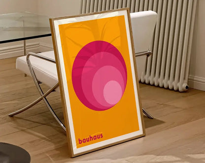 Decorbites™ geometric bauhaus canvas poster with concentric pink circles on orange wall art in a light wood frame for home decor