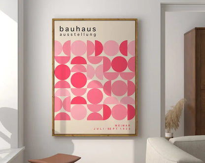 Framed geometric bauhaus canvas poster with pink overlapping circles and juli-sept 1923 text for modern decor