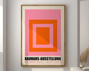 Framed decorbites™ geometric bauhaus canvas poster with concentric pink and orange squares and black text wall art