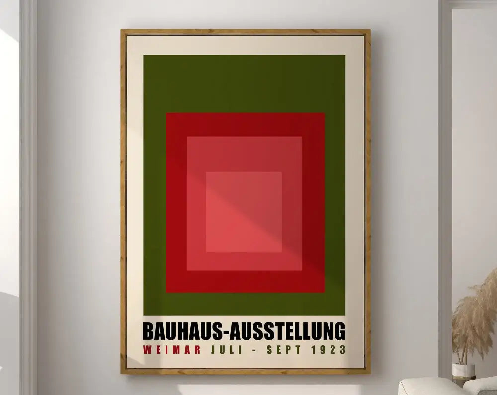 A framed geometric bauhaus canvas poster with red and green squares and black text on cream decorbites canvas poster