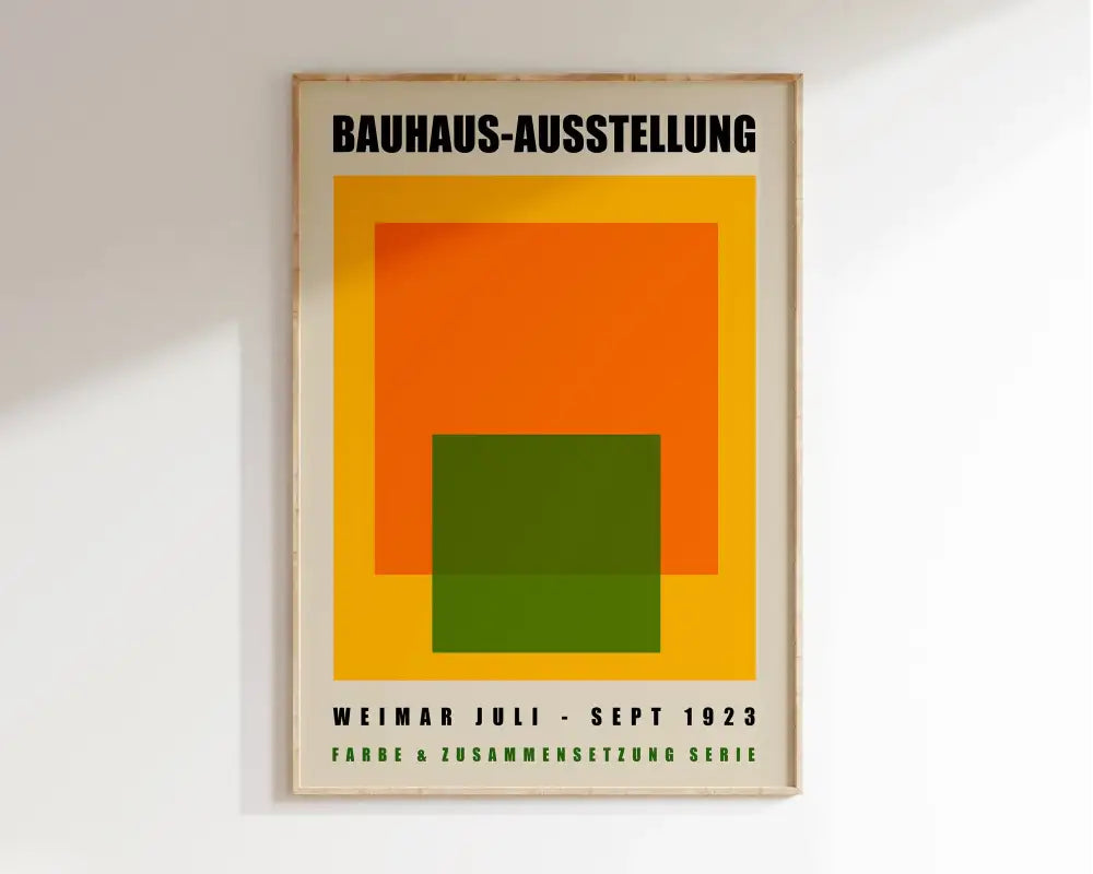 A framed decorbites™ geometric bauhaus canvas print with bold orange green and yellow shapes on cream background modern wall art