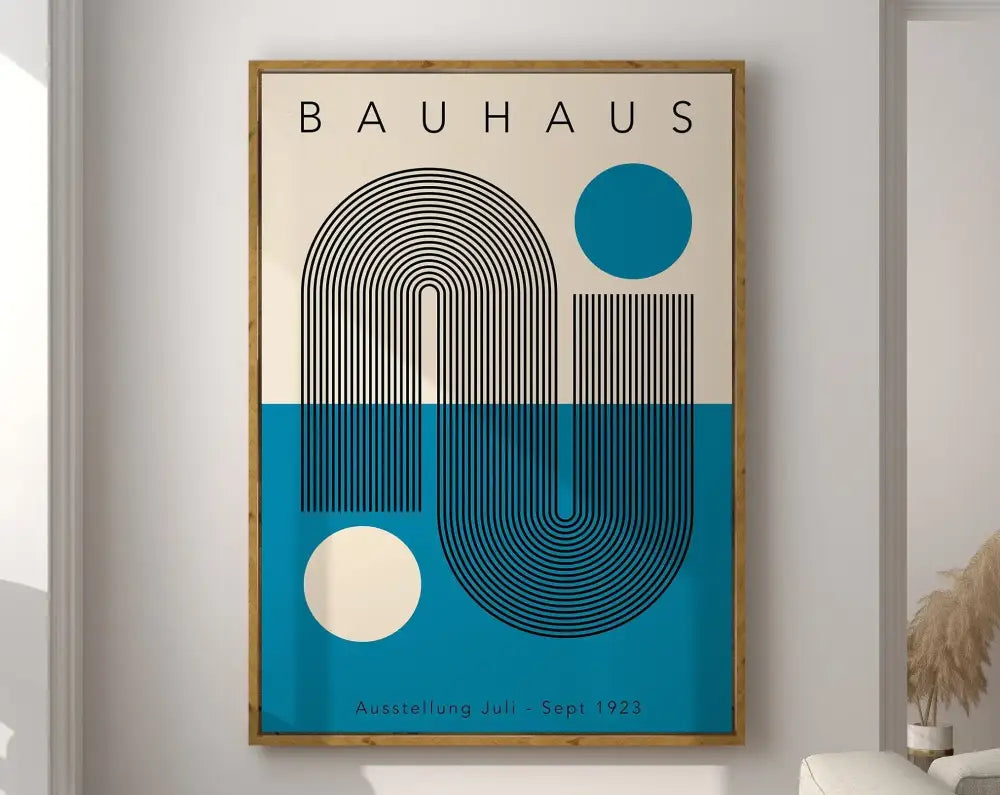 A framed geometric bauhaus canvas poster with black curved lines on cream and teal background in a light wood frame