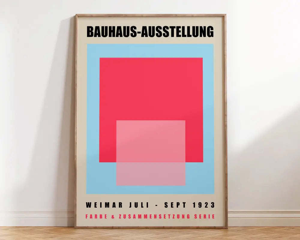 A minimalist geometric bauhaus canvas print in red and pink on light blue background for bright home decor by decorbites