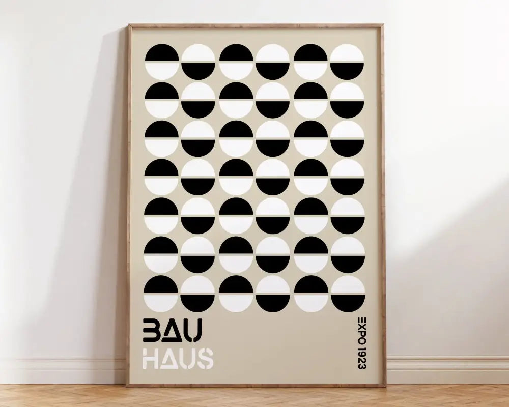 Minimalist geometric bauhaus canvas print featuring black and white half-circles on beige wall art by decorbites
