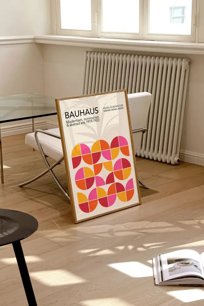 A framed decorbites™ geometric bauhaus canvas print with vibrant orange and pink circles for home decor