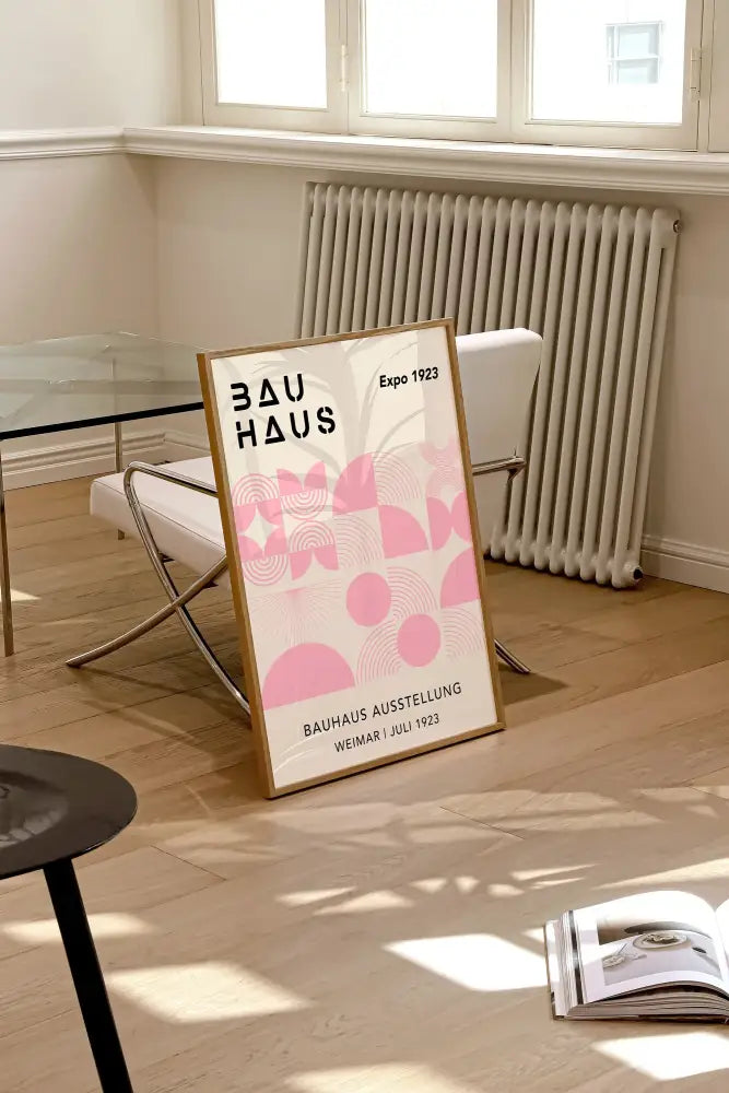 A framed DecorBites™ geometric bauhaus canvas print with pink patterns and black text for modern home decor