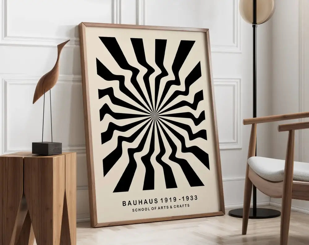 A framed decorbites™ geometric canvas poster with bold black and cream radial stripes in a light wood frame