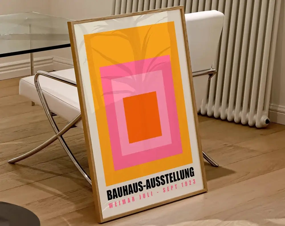 A framed decorbites™ geometric canvas poster featuring bold bauhaus shapes in orange pink and yellow hues