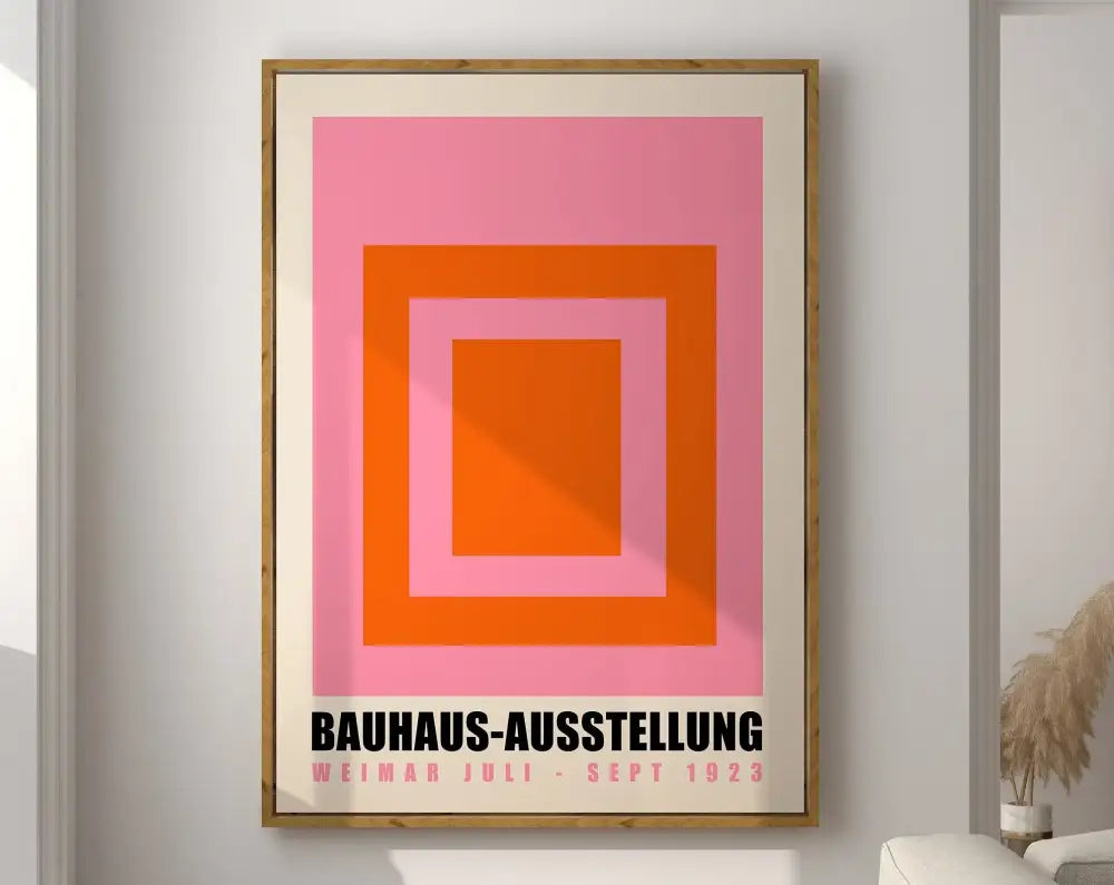 Framed decorbites™ geometric canvas wall art featuring concentric pink and orange squares with black bauhaus text on cream mat