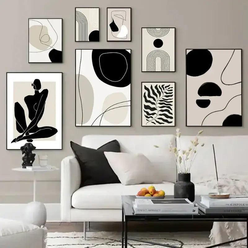 A collection of minimalist boho canvas prints featuring geometric leaf rainbow designs in black white and beige tones