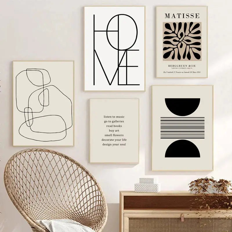 Minimalist black and white boho canvas wall art featuring geometric leaf rainbow abstract designs and typography