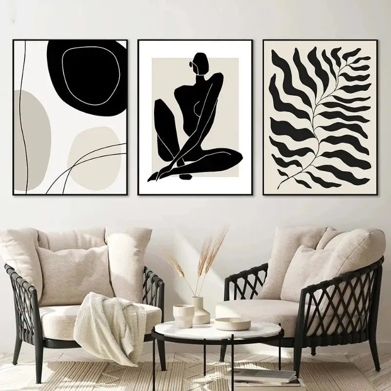 Three minimalist black and white framed boho canvas art prints featuring geometric leaf rainbow designs above a sofa