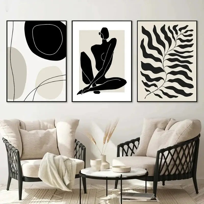 Three minimalist black and white boho canvas prints featuring geometric leaf rainbow shapes framed in thin black frames