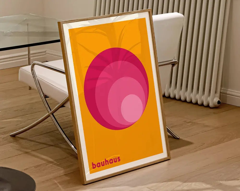 Decorbites™ geometric canvas poster featuring concentric pink circles on orange background in light wood frame wall art