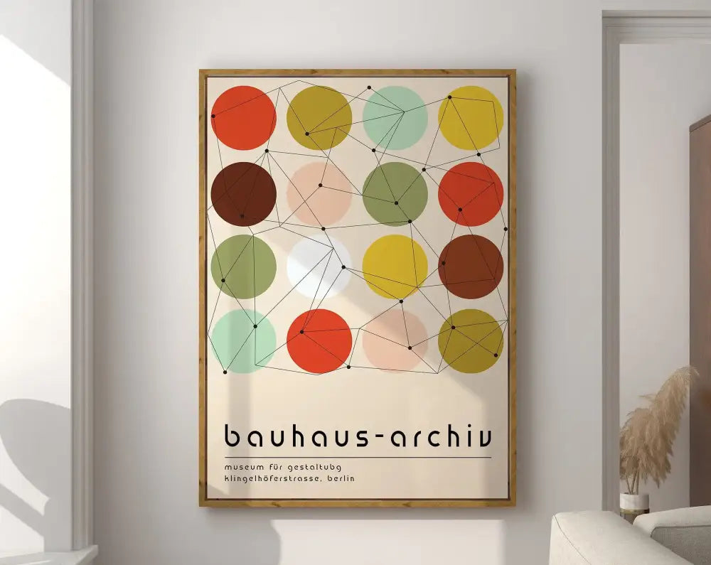 A framed bauhaus-style geometric modernist canvas poster with overlapping orange yellow green and brown circles on cream background