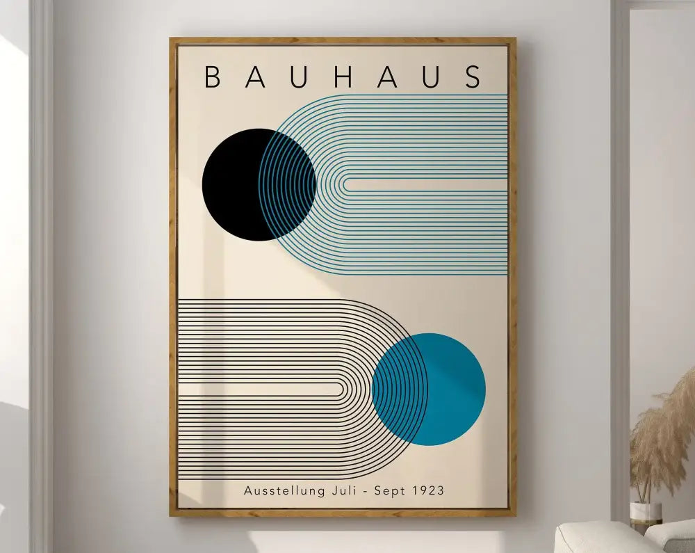 A framed decorbites™ geometric modernist canvas poster with bold black and teal shapes in a light wood frame