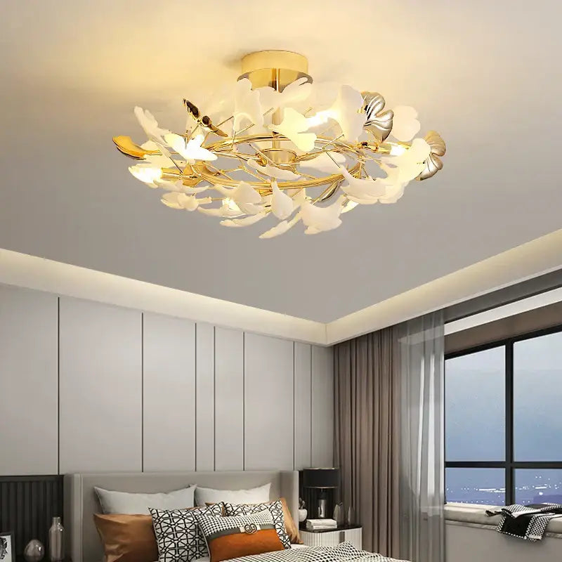 Gold-toned DecorBites Ginkgo Leaf bedroom lamp with white and silver leaf accents for elegant minimalist ceiling lighting
