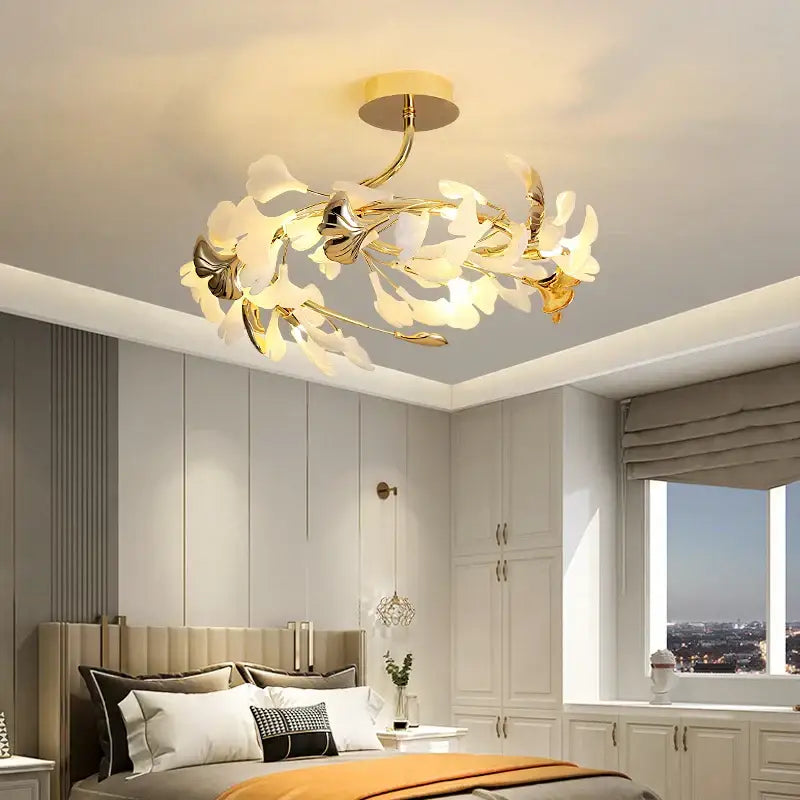 Gold-toned decorbites ginkgo leaf bedroom ceiling light with delicate white and metallic flower-like shades for master bedroom