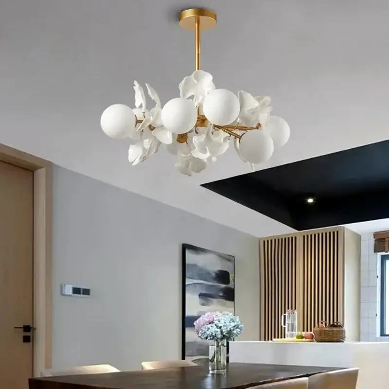 White ceramic flower and globe chandelier with gold-toned metal arms decorbites ginkgo leaf led ceiling light