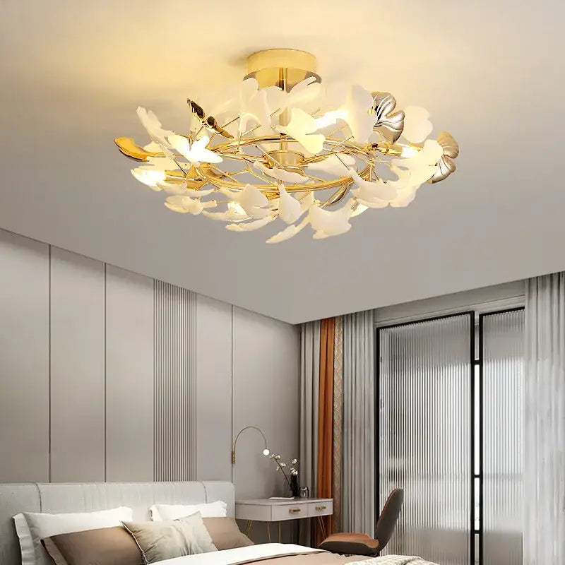 Gold-toned pendant chandelier with delicate white and silver ginkgo leaf accents decorbites ginkgo leaf pendant chandelier