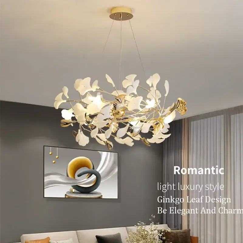 Gold-toned pendant chandelier with delicate white ginkgo leaf accents from decorbites ginkgo leaf pendant collection