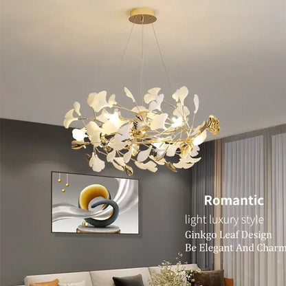 Gold-toned pendant chandelier with delicate white ginkgo leaf accents from decorbites ginkgo leaf pendant collection