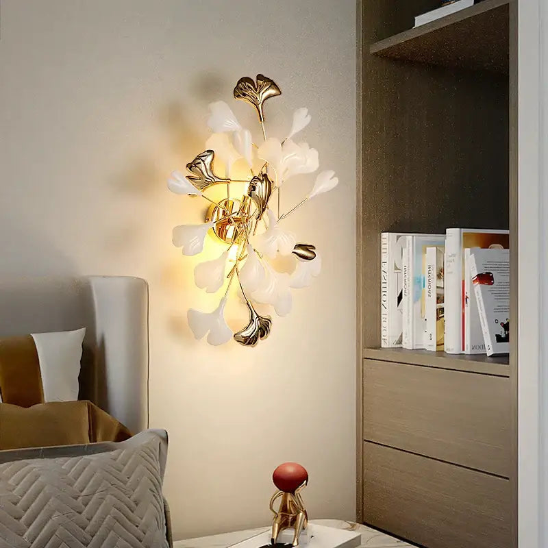 Gold-toned DecorBites Ginkgo Leaf wall lamp with delicate translucent white and metallic leaf accents for modern luxury decor