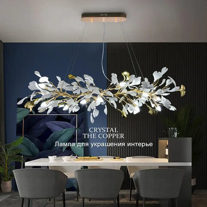 A modern decorbites ginkgo leaves chandelier with white and gold leaf accents and copper ceiling fixture for luxury spaces
