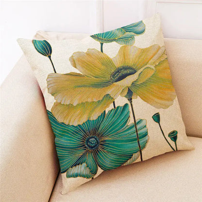 Beige linen cushion cover with vibrant yellow and teal poppies and detailed green stems for decorbites ginkgo leaves collection