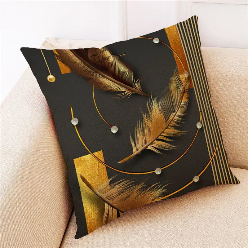 Black linen cushion cover with golden ginkgo leaves, geometric gold accents, and silver beads by decorbites ginkgo leaves