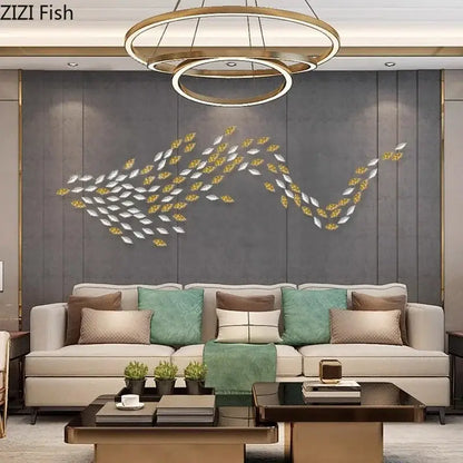 A modern metallic fish-shaped wall decor with alternating silver and gold leaf pieces by decorbites ginkgo leaves wall