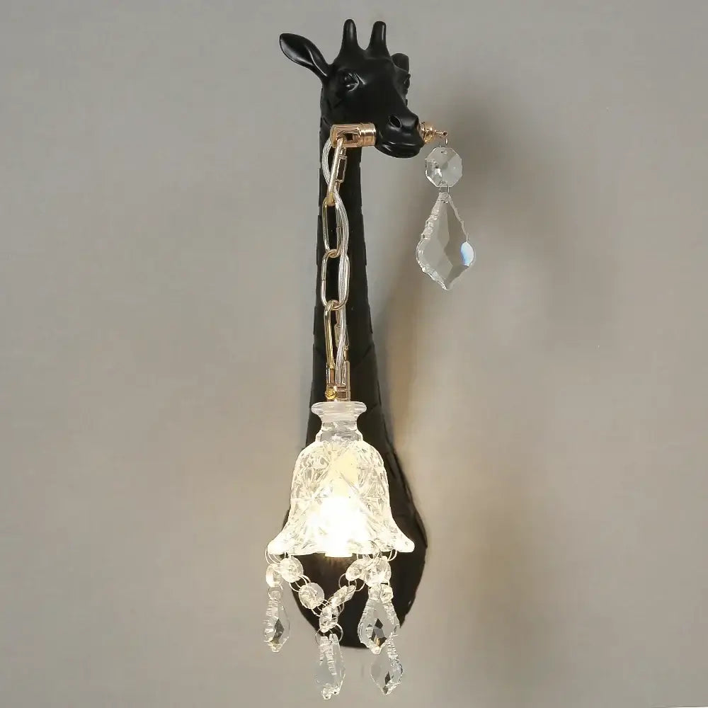 Black giraffe resin wall lamp sconce with gold-toned chain and crystal accents by decorbites for bedside and living room decor