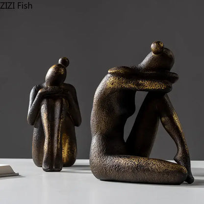 Bronze-finished decorbites girl statue bookends with textured golden resin surface for desk or bookcase decor