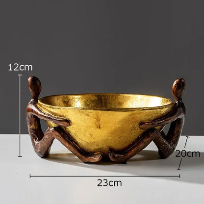 Golden bowl with sculpted metallic girl statue handles as decorbites girl statue bookends for desk or library decoration