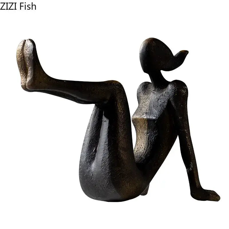 Abstract bronze-colored resin decorbites girl statue of a seated woman with one leg extended for bookends decor