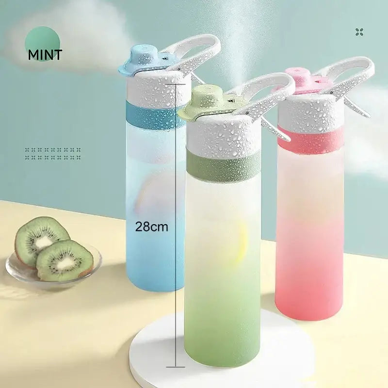 Three gradient-colored translucent plastic decorbites girls spray water bottles with white caps for outdoor sports fitness and travel