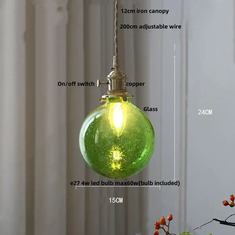 Green glass globe pendant lamp with copper hardware and adjustable wire suspension from decorbites glabe led collection