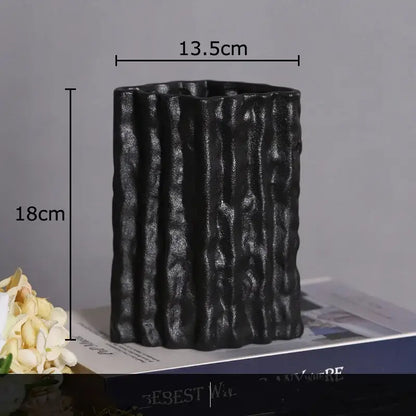 Black ceramic vase with vertical ribbed texture and matte finish from decorbites glacial ceramic vase collection