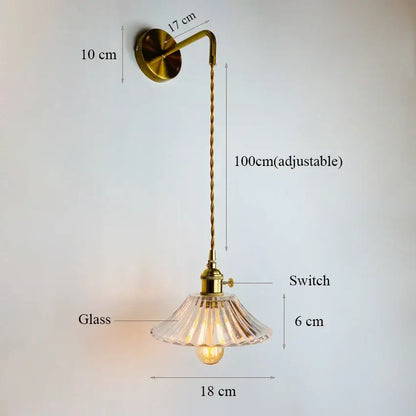 Brass-finished decorbites glass adjustable wall light with clear fluted glass shade and 100cm twisted cord for bedroom use