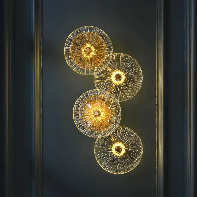 Golden translucent DecorBites glass aisle wall light with intricate radial patterns and warm glowing centers for living room