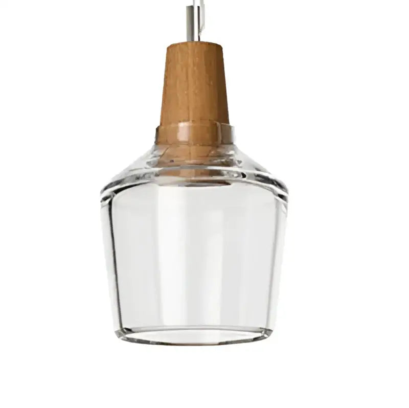 Clear glass pendant light with wooden top and metal suspension by DecorBites glass ideal for modern dining decor