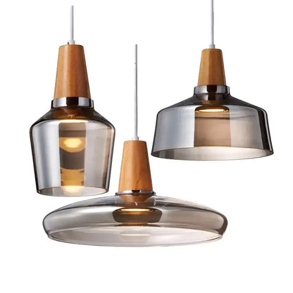 Three modern decorbites glass and wood pendant lights with smoked glass shades for retro dining loft decor